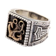 A premium two-tone sterling silver and brass anchor viking ring with ornate Thor's Hammer side engravings.