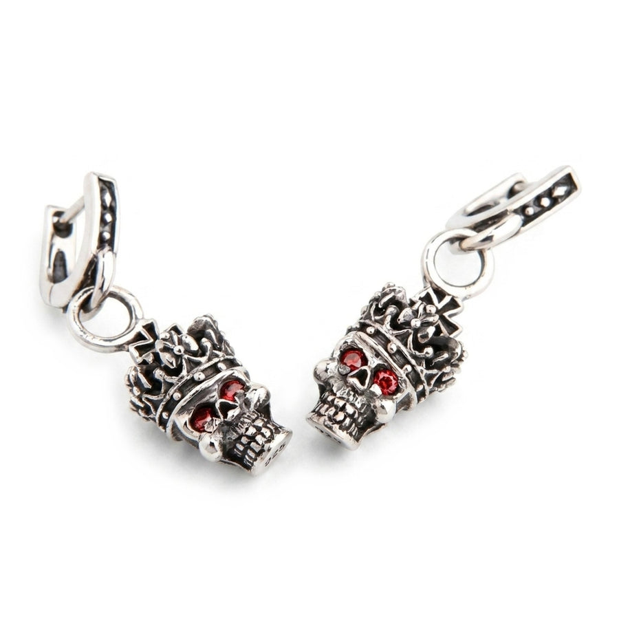 Crown skull dangle earrings in oxidized .925 sterling silver with red garnet eyes, angled front pair view