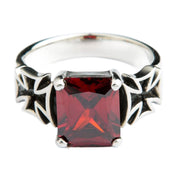 A front-on view of the men's red garnet biker ring with Iron Crosses.