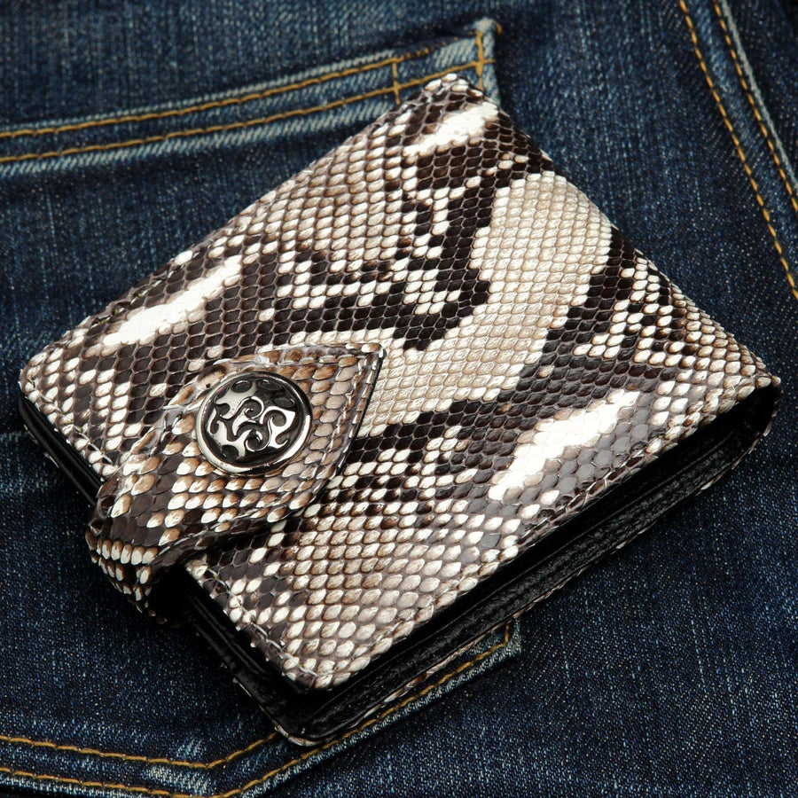 A genuine cobra skin wallet with a unique, natural snakeskin pattern and a custom sterling silver flame concho.