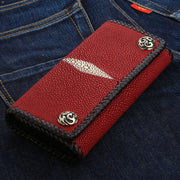 A closed view of the genuine red stingray leather wallet, showing the unique pearl-like texture and white 'eye'.