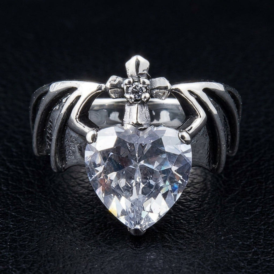 Front view of the Gothic Claddagh Ring featuring a faceted CZ heart, claw hands, and a cross crown in dark silver.