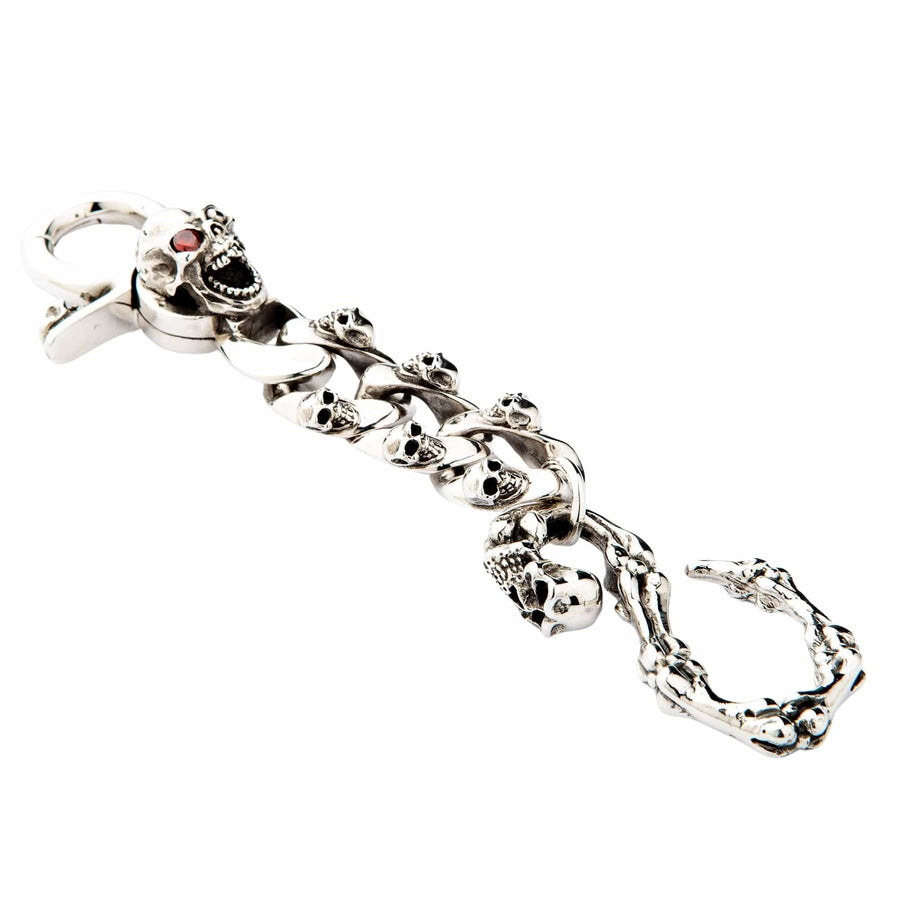 Full view of sterling silver skull keychain featuring a large mad skull with a red garnet eye.