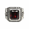 A men's solid sterling silver gothic cross ring, featuring a large red garnet CZ stone and a halo of clear accents.