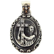 A men's solid sterling silver pendant depicting a saint holding a cross paved with clear stones.
