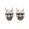 Pair of .925 sterling silver stud earrings shaped like Japanese Oni demon masks featuring curled horns and snarling mouths.
