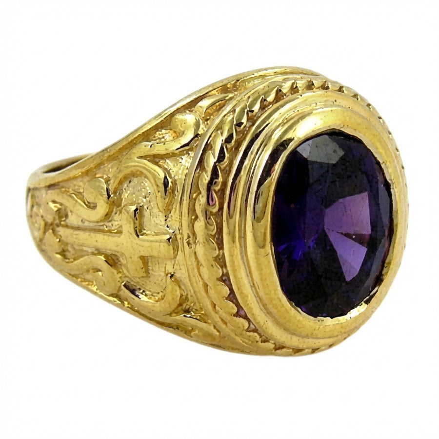 Ornate yellow gold cross bishop ring with oval amethyst gemstone, front view on white background