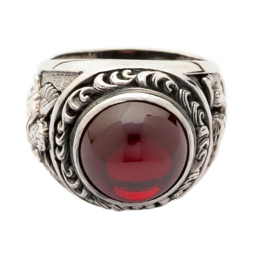 A front view of the sterling silver red stone cupid love ring, showing the large cabochon gemstone.
