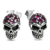 Ruby skull stud earrings in .925 sterling silver with red pavé stones, front view of both skulls