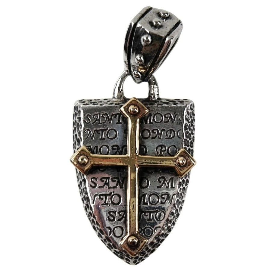 Front view of a sterling silver shield pendant featuring a raised brass cross, engraved text, and textured edges.