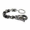 Dragon talon clasp in sterling silver up close: scaled body, curved polished claw lever and claw links to the key ring