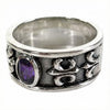 Side angle of the ring showing the intricate Fleur De Lis Gothic carving and oxidized finish