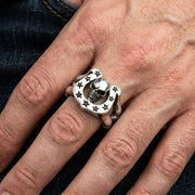 skull-horseshoe-ring-on-hand-