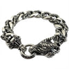 Full view of handcrafted sterling silver dragon bracelet with ornate curb chain and toggle closure