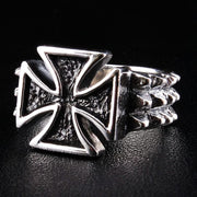 An angled view of the sterling silver iron cross ring, highlighting the studded thorn band.