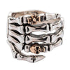 Sterling silver skeleton hand ring with rose gold skull and gothic cross front view on white background
