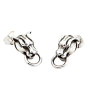 Pair of sterling silver tiger head stud earrings with ring hoops on a white background.