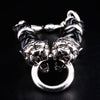 Tiger head sterling silver bracelet front view showing dual tiger heads gripping silver ring
