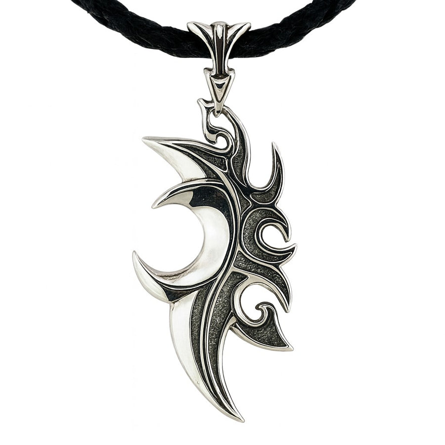The silver tribal flame pendant shown on a black leather necklace.
