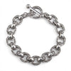 Top visning af sterling sølv tribal vine armbåndet med tykke graverede ovale led og en toggle-lås