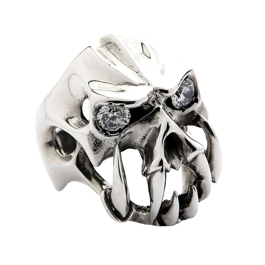 The abstract demon skull ring with large fangs and diamond eyes, isolated on a white background.