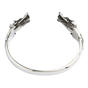 Front view of the handcrafted sterling silver dragon cuff bracelet on a white background.