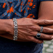 A man's wrist wearing the heavy, 90-gram sterling silver Knight Rider link bracelet.