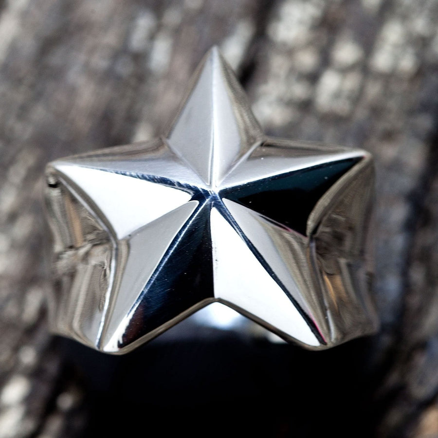 A men's solid sterling silver star ring with a bold, three-dimensional design and a high-polish finish.