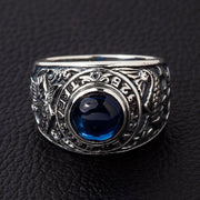 Front view of the men's blue stone koi ring in solid 925 sterling silver with engraved text.